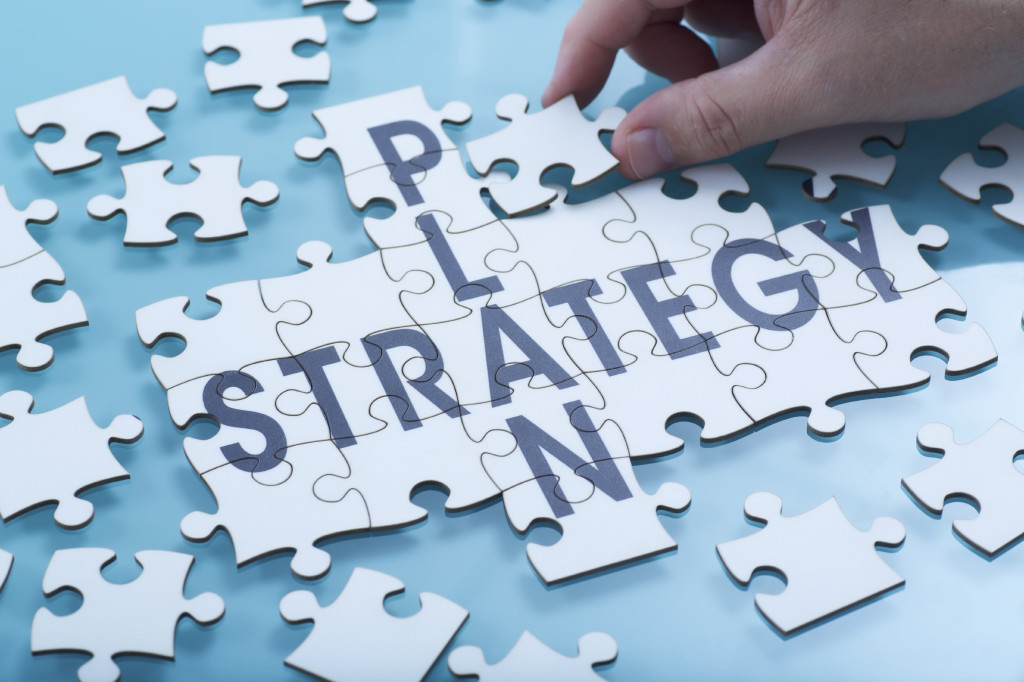 A jigsaw of the words Plan and Strategy