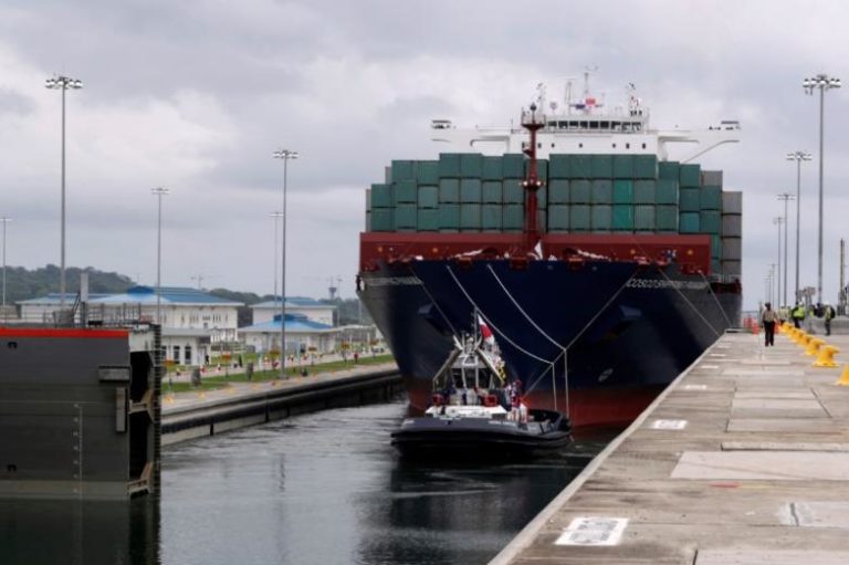 A floating gate is opening to the Chinese COSCO container vessel named Andronikos navigating through the Agua Clara locks during the first ceremonial pass through the newly expanded Panama Canal in Agua Clara