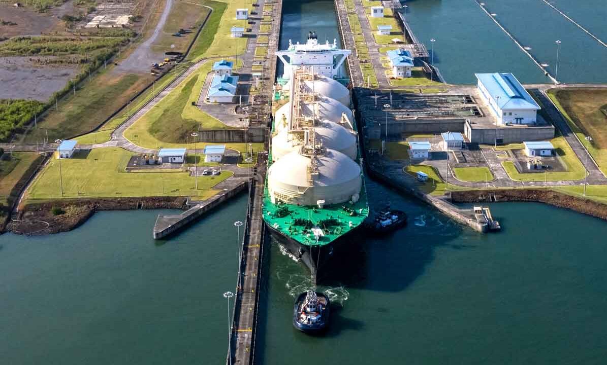 Panama Canal transit increase showing a Neo-Panamax vessel crossing the Cocoli locks during high-traffic hours.