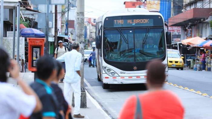 Fuel price hike affecting a gas station in Panama City with transport trucks.