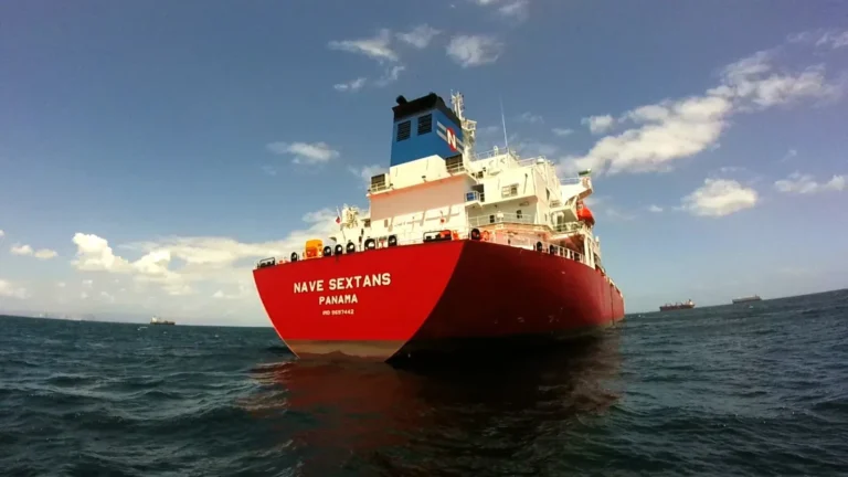A large cargo ship carrying the Panama flag, representing the strength of the Panama ship registry and its commitment to global shipping security.