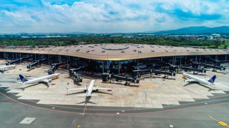 A modern airplane taking off from a major international airport, representing top-tier Panama air connectivity and regional travel.