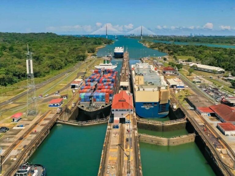 Cargo vessels navigating the locks under structured Panama Canal autonomy to maintain global trade efficiency.