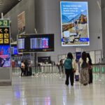 Multiple airplanes parked at the gates during a major surge in Panama aviation growth.