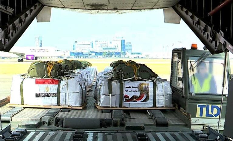 Pallets of emergency medical supplies being loaded onto a cargo aircraft for a vital humanitarian aid shipment.