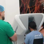Specialist performing remote robotic surgery console in Panama connecting to Chiriqui hospital.
