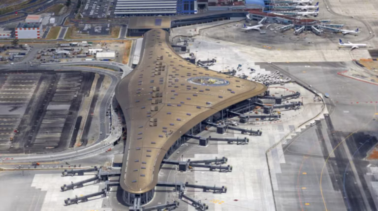 Passengers walking through the modern concourse undergoing the Tocumen airport expansion in Panama.